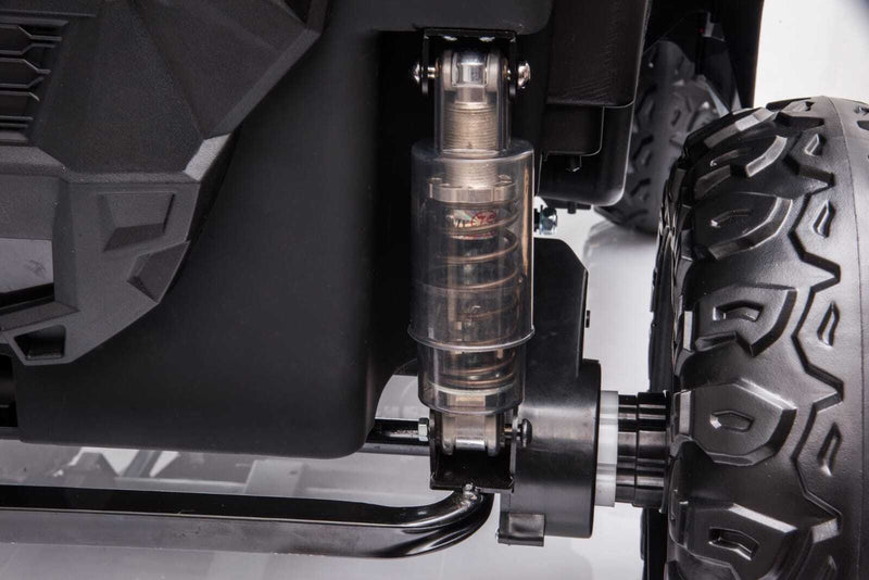 Jeep elétrico infantil rosa com suspensão independente, ideal para terrenos irregulares e passeios confortáveis